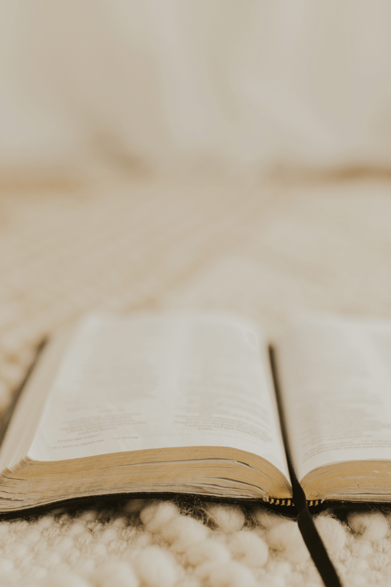 Bible laying open on boho rug