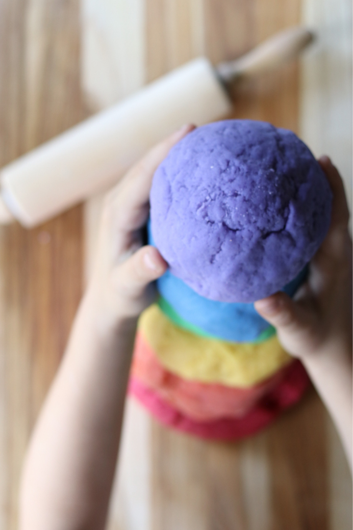 Rainbow colored tower of homemade playdoughj